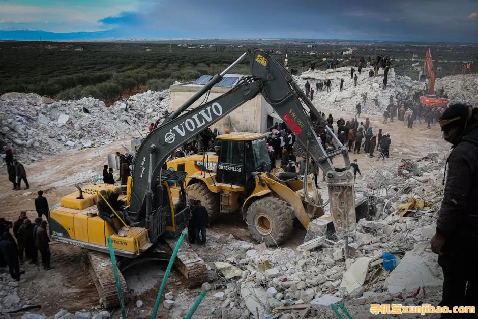 Rescue operations with excavators clearing ruins after an earthquake in Idlib, Syria.